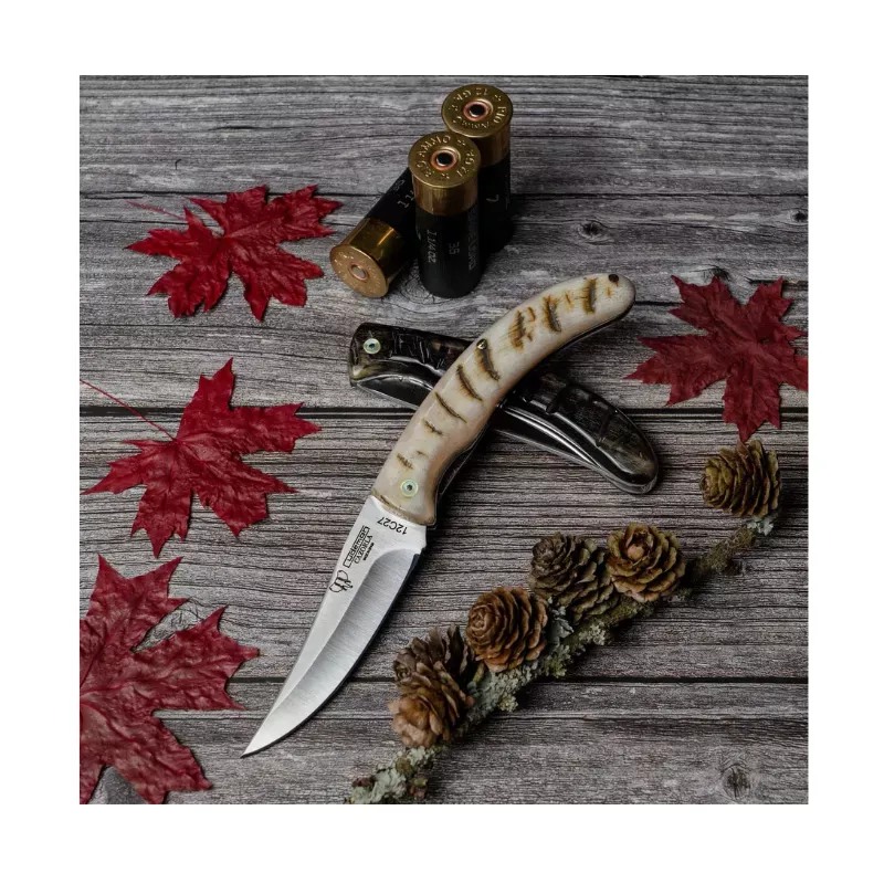 CUDEMAN - FOLDING SKINNER 8.5CM CLIP-POINT, RAM BONE HANDLE (374-M)